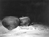 Interior view of a petchka bake chamber, showing cast iron cooking pots (Chugun or Garschok) surrounded by sand.