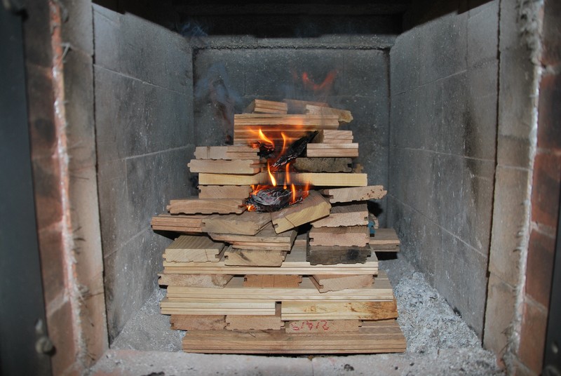 a tightly stacked, medium sized fire of short hardwood planks. 1