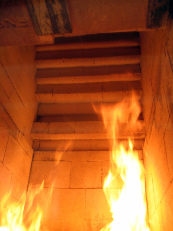 View up into the fire box towards the end of a large fire.