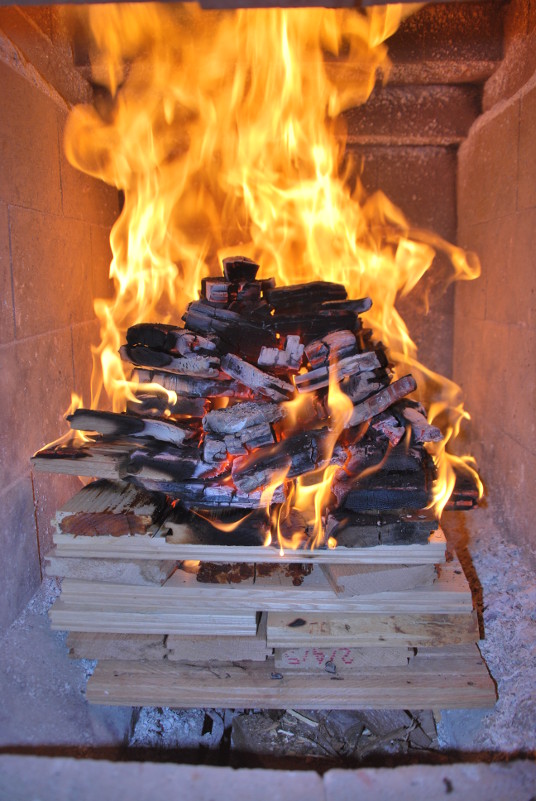 a tightly stacked, medium sized fire of short hardwood planks. 2