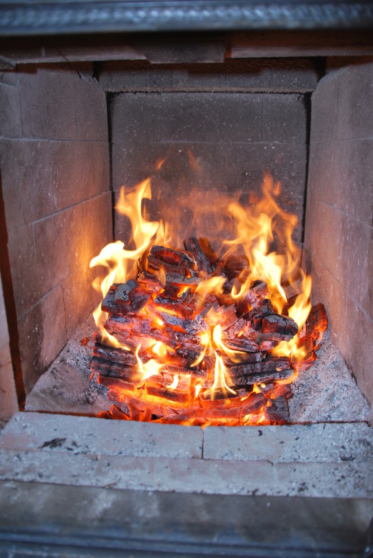 a tightly stacked, medium sized fire of short hardwood planks. 3